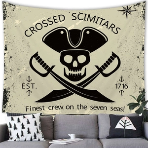 Detail of nautical pirate tapestry with skull and scimitars over a modern sofa
