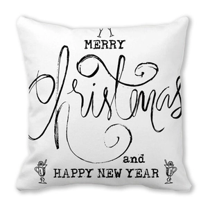 Detail of soft peach skin pillowcase with black Merry Christmas and Happy New Year print