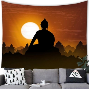 Detail of Buddha silhouette tapestry on white wall above a sofa in a cozy room