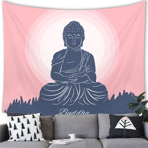 Detail of Buddha wall tapestry hanging above a grey sofa in a serene zen living room setting