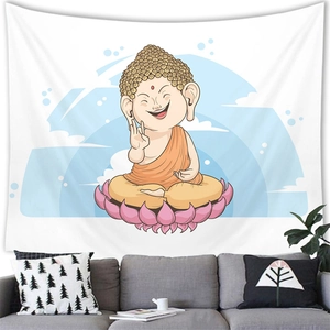 Detailed view of Buddha wall tapestry hanging above a modern sofa in a home setting