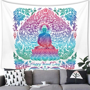 Detail showing the colorful Buddha silhouette tapestry on a wall above a sofa in a living room
