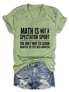 Flat lay of heather green V-neck T-shirt with math slogan and denim shorts on white background