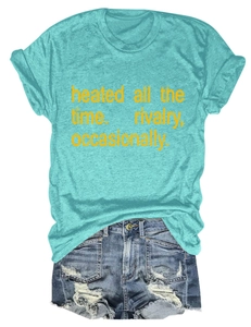 Flat lay of a green graphic T-shirt with text and distressed denim shorts for summer