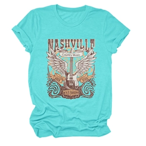 Detail of teal Nashville country music t-shirt with electric guitar and wing graphic