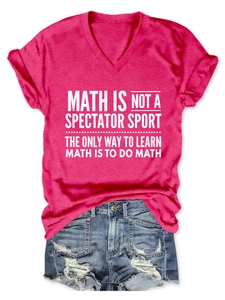 Detail of pink V-neck T-shirt with white math slogan paired with distressed denim shorts