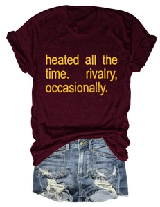 Detailed flat lay of a burgundy crew neck T-shirt with quote and distressed denim shorts