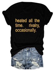 Detail view of cotton t-shirt with yellow text print and frayed denim shorts