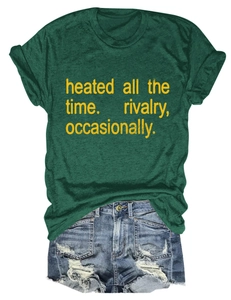 Detailed close-up of dark green short sleeve T-shirt with printed yellow text and denim shorts