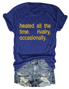 Flat lay of navy blue short-sleeve T-shirt with yellow text and frayed denim shorts
