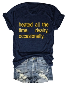 Detail of navy crew neck T-shirt with yellow slogan and distressed denim shorts