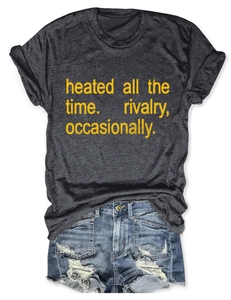 Flat lay of gray crewneck t-shirt with yellow text and distressed blue denim shorts