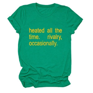 Detailed close-up of grass green crewneck T-shirt with yellow slogan on cotton fabric
