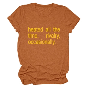 Close-up of burnt orange round neck T-shirt with yellow heated all the time typography