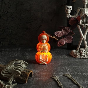 Glow pumpkin lantern with skull skeleton interior for Halloween party scene decoration