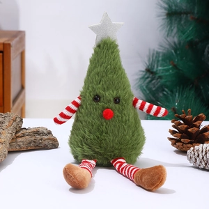Macro shot of green plush Christmas tree doll with silver star and striped limbs