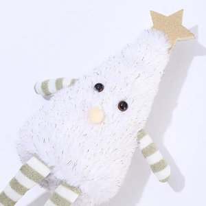 Close-up of a white plush Christmas tree doll with gold stars and striped legs