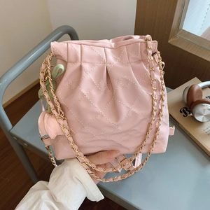 Pink quilted chain hobo bag with tulip charm and elegant gold metal leather strap
