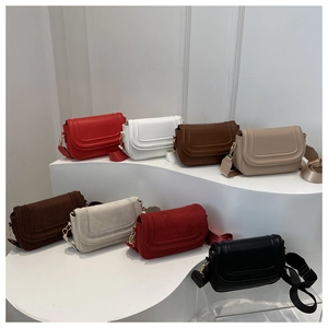 Collection of saddle bags in eight colors featuring matte leather and suede textures