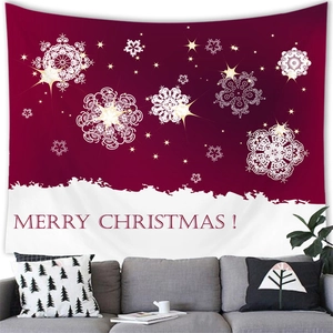 Detalle de un tapiz navideño festivo con copos de nieve y deseos de Feliz Navidad