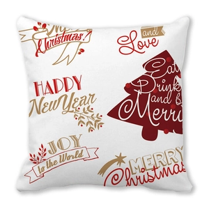 Detail view of peach skin fabric cushion cover with red and gold Christmas lettering