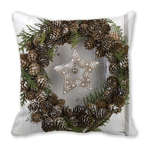 Detailed view of Christmas pillowcase featuring pinecone wreath and star patterns