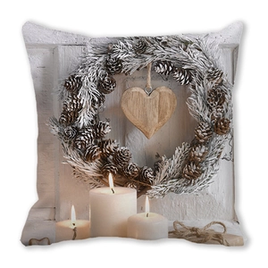 Close-up of Christmas pillowcase featuring printed candles and pine cone wreath detail