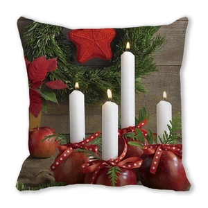 Detail of Christmas cushion showing red candles and holiday floral patterns