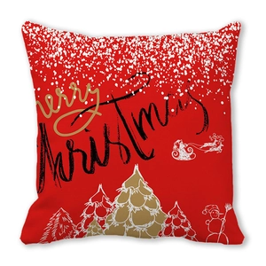 Detail of red Merry Christmas pillowcase with golden tree and snowman patterns