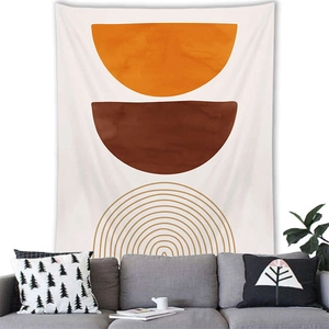 Detail of Nordic geometric wall tapestry hanging over a sofa in a modern cozy room