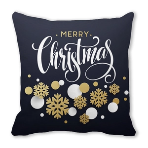Detail of Merry Christmas pillowcase with gold snowflake patterns on black peach skin fabric