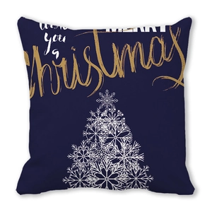 Detail view of square Christmas pillow cover with golden Merry Christmas text and snowflake tree