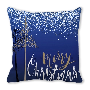 Detail of dark blue Merry Christmas cushion cover with golden trees and snow pattern
