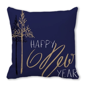 Close-up of Happy New Year gold lettering on a navy blue velvet throw pillow cover