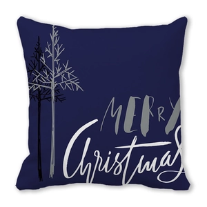 Detail of navy blue Merry Christmas cushion cover with white abstract trees and artistic text