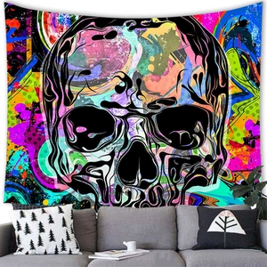 Detailed view of a psychedelic skull tapestry with vibrant splash art in a modern living room