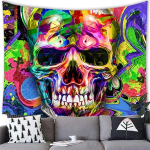 Vibrant abstract skull art tapestry with psychedelic colors hung over a modern sofa