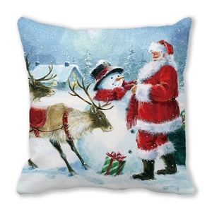 Detail of Christmas pillow featuring Santa, reindeer, and snowman on soft peach skin fabric