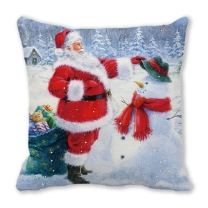 Detail of Christmas pillow cover featuring Santa Claus and snowman festive illustration
