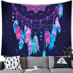 Watercolor feather dreamcatcher tapestry on a grey sofa wall in a Nordic style living room