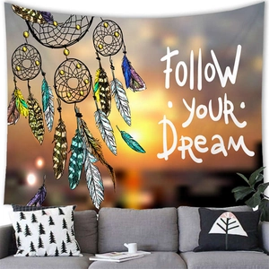 Dreamcatcher watercolor tapestry with Follow Your Dream quote over a cozy sofa decor