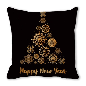 Close-up of black pillowcase featuring a golden snowflake Christmas tree and Happy New Year text