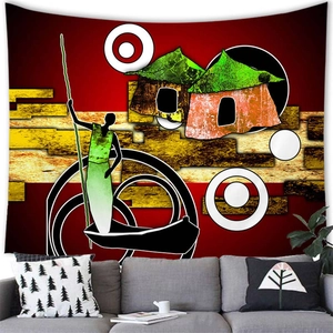 Detailed view of an African tribal art tapestry hanging above a modern living room sofa