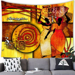 Detail of African woman silhouette tapestry hung over a grey sofa in a living room