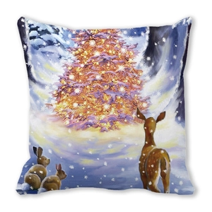 Detail of Christmas pillow cover with golden festive tree and woodland animals print