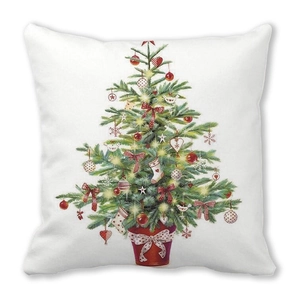 Detail of Christmas tree print on white pillow cover with festive bow decorations