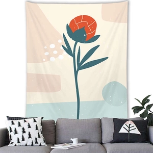 Detail of Nordic Morandi plant tapestry with abstract orange flower over a grey sofa