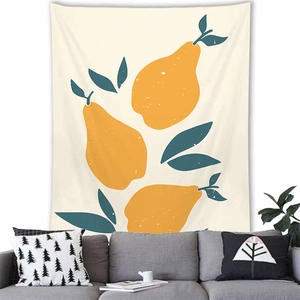 Detail of Nordic plant wall tapestry above a modern grey sofa with geometric pillows