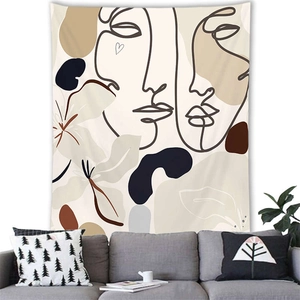 Minimalist Morandi style tapestry with abstract faces and botanical lines in a cozy living room
