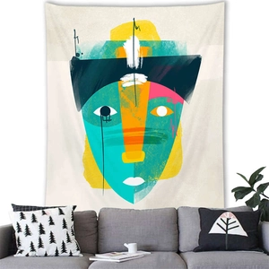 Detailed texture of Morandi abstract face wall tapestry hanging over a grey sofa